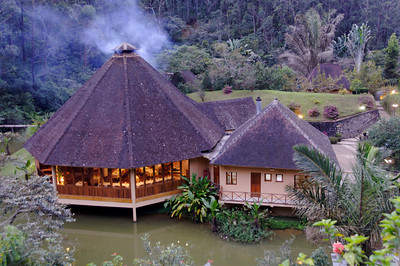 Evening twilight view on the restaurant of the Vakona Forest Lodge from our room high up the hill