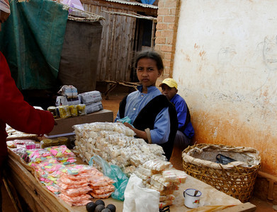Girl on the market, looking at the tourists...